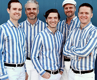 Five band members pose in their striped shirts.