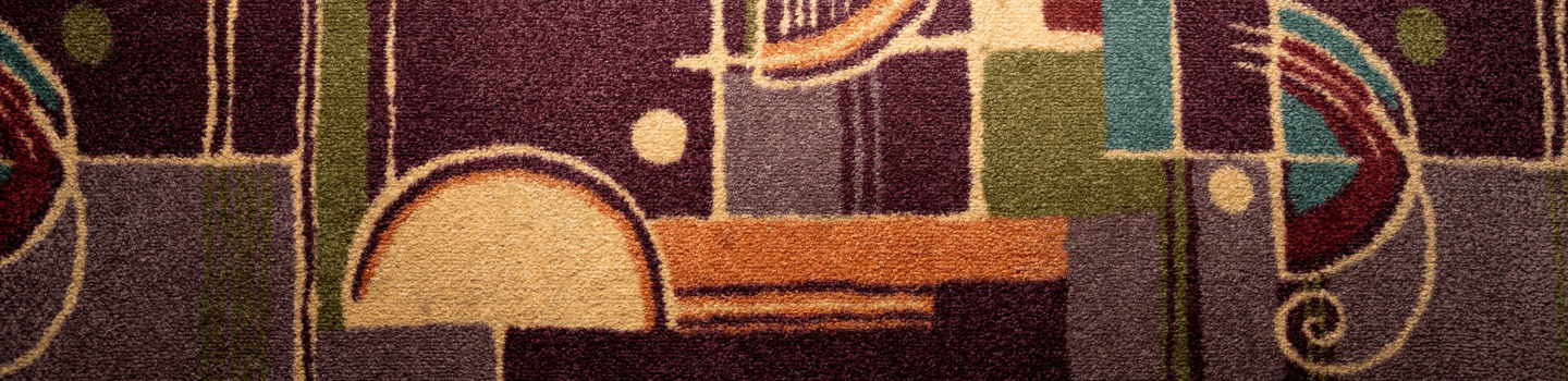 close up showing whimsical pattern of the tower theatre carpet