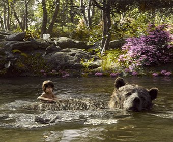 A boy and a bear float down a river.