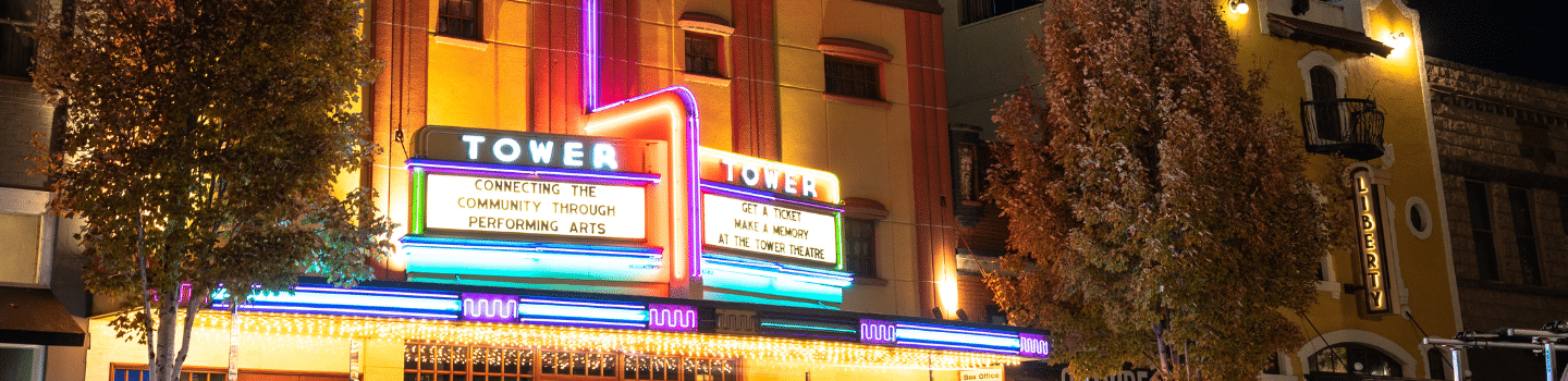 marquee sign with a message that says connecting the community through the performing arts