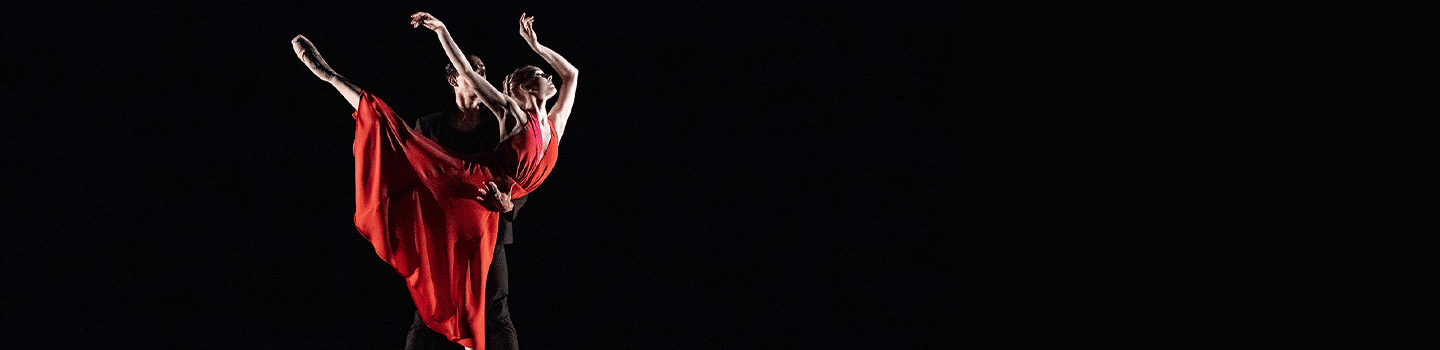 A ballerina in a red dress.
