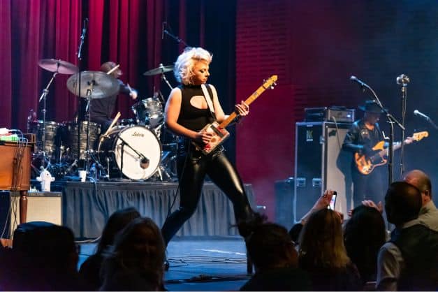 Samantha Fish plays electric guitar on stage